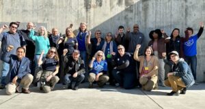 Members of the Unit 17 bargaining team and their supporters raising their fists outside of the bargaining session at UC Berkeley in