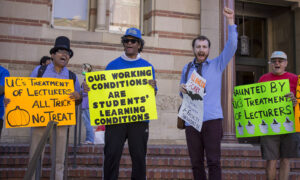 UC-AFT members hold signs at a Halloween-themed action in 2019. Handmade signs read (left to right): "UC's treatment of lecturers - All trick, no treat", "Our Working Conditions are Students' Learning Conditions," "Halloween is Scary - Social Security for Faculty Shouldn't Be" and "Haunted by UC's Treatment of Lecturers"